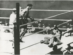 Boxer Jack Dempsey (middle) knocks down heavyweight champion Gene Tunney (right) in their title bout at Soldier's Field in Chicago on Sept. 22, 1927. The fight is known as "The Long Count" because Tunney was down 14 seconds, but only received a nine count before getting back on his feet. The discrepancy arose because referee Dave Barry spent five seconds taking Dempsey to his corner before starting the count. Tunney went on to win the fight.