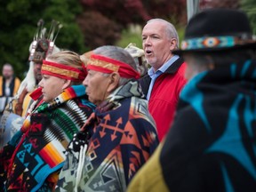 B.C. Premier John Horgan speaks before the raising of a replica Haida totem pole on the traditional territory of the Semiahmoo First Nation, at the Douglas-Peace Arch border crossing, in Surrey, B.C., on Friday September 21, 2018. The original pole was raised at the border crossing in the 1950s and removed without consultation or notice during the reconstruction of a visitor centre in 2008.