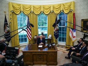 U.S. President Donald Trump listens during a phone conversation with Enrique Pena Nieto, Mexico's president, not pictured, in the Oval Office of the White House in Washington, D.C., U.S., on Monday, Aug. 27, 2018.