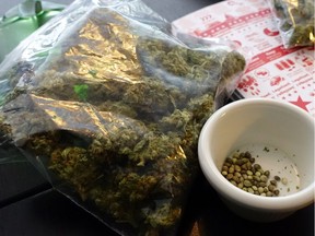 A one-ounce (28.3-gram) bag of cannabis and a bowl of seeds rest on a table. As of Oct. 17, Canadians the age of majority in most provinces (19 in B.C.) gained the right to grow up to four plants per household.