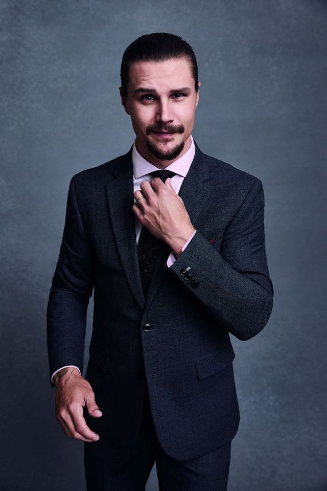 NHL player Erik Karlsson is pictured in an RW&CO. suit.