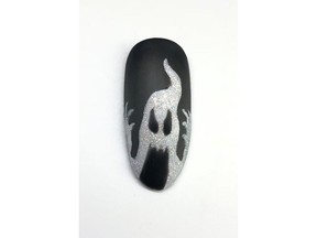 Halloween ghost nails by John C. Nguyen, an educator for CND.