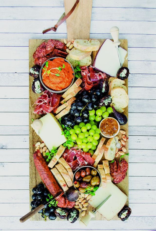 The new book On Boards: Simple & Inspiring Ideas to Share at Every Gathering by Lisa Dawn Bolton explores the boundaries of food boards. Handout: Appetite by Random House. 