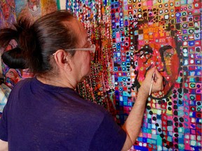 Norman James Hall painting one of the six banners bringing indigenous chiefs and artists to life at Vancouver Public Library's Aperture. The six banners are being installed in the promenade at Library Square in late October/early November, 2018.  [PNG Merlin Archive]