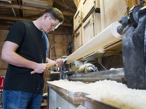 Oscar Porcellato, a Grade 11 student at New Westminster Secondary, begins work on his 15th homemade baseball bat in the family's back-alley garage.