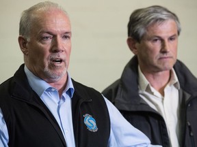 Premier John Horgan and Liberal leader Andrew Wilkinson are on opposition sides of the proportional representation debate.
