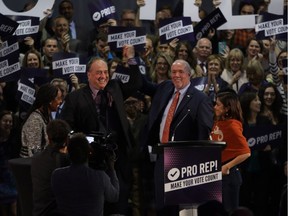 B.C. Green party Leader Andrew Weaver (left) and Premier John Horgan, shown at a Victoria rally on Tuesday, are in favour of proportional representation.