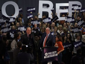 Premier John Horgan and B.C. Green Party leader Andrew Weaver following their speeches at a rally in support of Proportional Representation to help launch the voting period for the referendum for electoral reform at the Victoria Conference Centre in Victoria on Oct. 23, 2018.