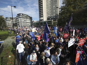 Anti-Brexit campaigners take part in the People's Vote March for the Future in London, a march and rally in support of a second EU referendum, in London, Saturday Oct. 20, 2018. Thousands of protesters gathered in central London on Saturday to call for a second referendum on Britain's exit from the European Union.