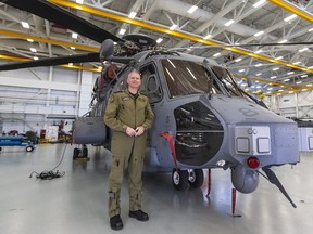 Lt. Colonel Travis Chapman, commander of 443 Squadron, with one of the new Cyclone helicopters in Victoria.
