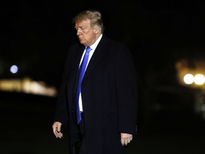 President Donald Trump crosses the South Lawn on his return to the White House, Saturday Oct. 13, 2018, in Washington, after a trip to Kentucky.