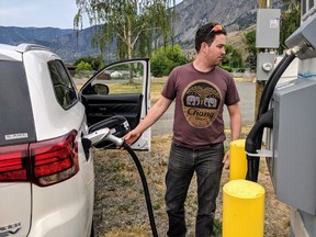 The owner of a Mitsubishi Outlander plug-in hybrid with a fast charger in Spences Bridge, B.C.
