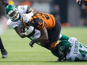 B.C. Lions running back Jeremiah Johnson is taken to ground by a pair of Saskatchewan Roughriders defenders during their Aug. 25 game at B.C. Place Stadium. The teams meet this Saturday in Regina in a game that has significance for both clubs when it comes to post-season placings.