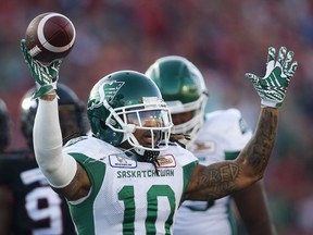 Tre Mason celebrates the Saskatchewan Roughriders' first touchdown in Saturday's 29-24 victory over the host Calgary Stampeders.