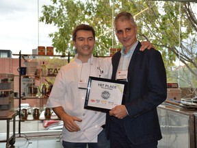 Giuseppe Cortinovis (left) accepts his first-place award for Canadian pizza chef of the year (traditional) in Toronto on Oct. 15, from Joe Di Donato, vice-president of Faema Canada, a maker of espresso and cappuccino machines. (Photo: Canadian Pizza magazine) [PNG Merlin Archive]