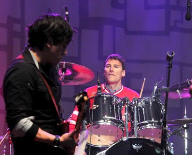 Mayor Gregor Robertson playing drums with Bitterly Divine at LiveCity Yaletown.