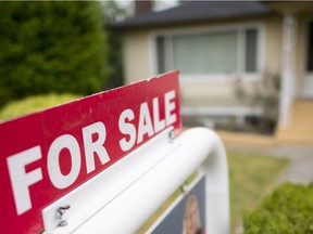 A real estate sign is pictured in Vancouver, B.C., Tuesday, June 12, 2018.