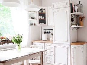Sometimes, all you need is a lick of fresh paint. Here Agnieszka 
Krawczyk, the former painter-in-residence for Annie Sloan, has updated a kitchen in rural Poland with nothing but Sloan’s Chalk Paint and Clear Chalk Paint Wax. She painted all the cabinets, the shelves, chair and table using two coats of Old White and then distressed heavily around the edges, especially on the table, to give a worn, rustic feel.