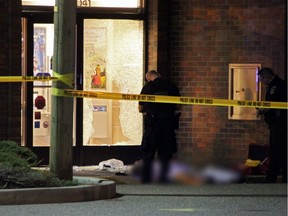 This photo has been partially blurred because of graphic content. Mandeep Grewal was gunned down outside the front door of a bank in the 32000-block of South Fraser Way on Thursday evening.