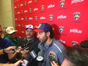 Florida Panthers netminder Roberto Luongo talks to the media Saturday before the pregame ceremony in Sunrise, Fla., honouring him for playing 1,000 games in the NHL. The former Canuck is the third goaltender in NHL history to play in 1,000 games.