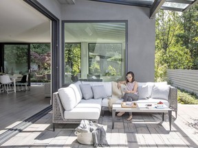 Joanna Leung, VP of Vancouver outdoor furniture company Ratana, says she's seeing more and more partially covered outdoor living areas, which makes these spaces usable year round Photo: Janis Nicolay for The Home Front: Using your outdoor living areas year round by Rebecca Keillor  [PNG Merlin Archive]
