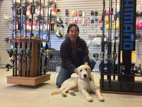 Ron Wakita, the owner of Reliable Guide and Charters and Ron's Mobile Fishing Tackle & Bait Shop, minds his store with golden retriever Luca. Wakita figures the LNG Canada project will bring with it little environmental risk.