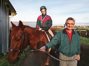 A young Miranda Orth rides Jasper while being escorted by Brin Powell at the Richmond Therapeutic Equestrian Society in December 1999. (Rob Kruyt/PNG FILES)