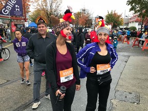Amrit Sandhu of New Westminster, left, and Melinda Brezova of North Vancouver share a laugh before Monday's Granville Island Turkey Trot 10K, which attracted a sold-out entry of 1,800-plus runners and walkers for the 22nd annual morning race.
