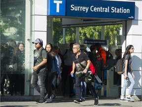 Transit riders exit Skytrain's Surrey Central station on Sept. 5, 2018.