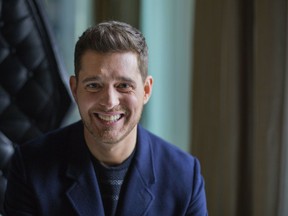 FILE - In this Tuesday, Oct. 18, 2016 file photo,Canadian singer Michael Buble poses for a photo to promote the upcoming Oct. 21 release of his new album "Nobody But Me" in Toronto. Grammy-winning singer Michael Buble is shutting down rumors that he's going to retire, saying he was misquoted in a recent interview. Buble told The Associated Press on Tuesday, Oct. 16, 2018 that he is not planning on retiring anytime soon. The Canadian singer is disputing an Oct. 13 interview published in the Daily Mail that said he would be would be quitting music after the release of his upcoming album "Love," which will be released Nov. 16.
