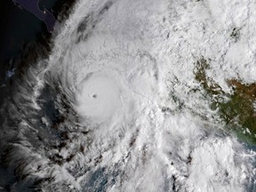 This GOES East satellite image provided by NOAA shows Hurricane Willa in the eastern Pacific, on a path toward Mexico's Pacific coast on Monday, Oct. 22, 2018.