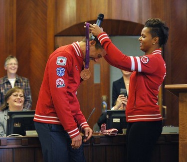 Mayor Gregor Robertson with soccer player Karina LaBlanc at Vancouver City Hall in Vancouver, B.C., Nov. 27, 2012.