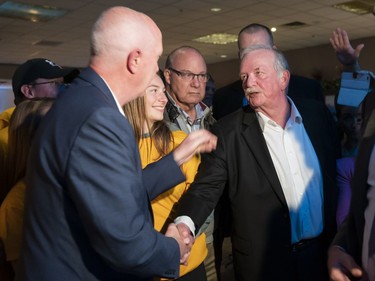 City of Burnaby Mayor elect Mike Hurley (left) is congratulated by outgoing mayor Derek Corrigan at his election headquarters after winning the 2018 municipal election.