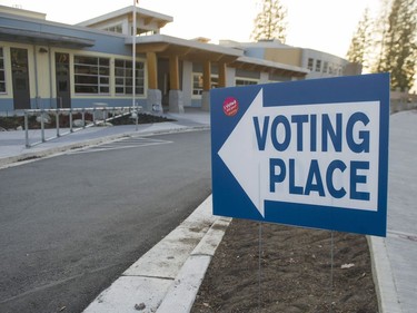 People leave Smiling Creek Elementary school in Coquitlam after voting in the province-wide civic election.