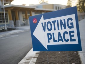 People leave Smiling Creek Elementary school in Coquitlam after voting on Saturday.