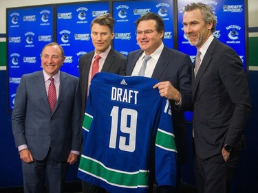 From left: NHL Commissioner Gary Bettman; Mayor, Mayor Gregor Robertson, Canucks owner Francesco Aquilini and Vancouver Canucks President, Hockey Operations Trevor Linden  announce 2019 NHL Entry Draft at Rogers Arena in Vancouver on Feb. 28, 2018.