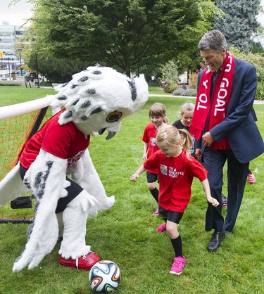 Mayor Gregor Robertson joins Canada Women's National Team mascot Shuéme and several young athletes for an impromptu game of footy as the City announces that tickets will go on sale for the FIFA Women's World Cup Canada 2015 on Sept 10, 2014.