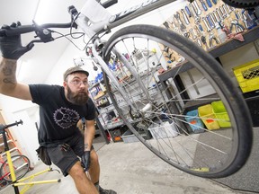 Jeremy Suhan fixes bikes at The Bike Kitchen at UBC in Vancouver, BC, Oct. 10, 2018.  There has been an uptick in bike theft on campus.