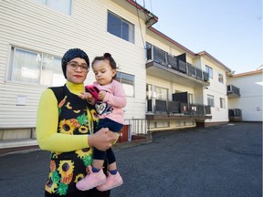 Siwar Ben Anes with daughter Darine, 19 months, outside their home in Burnaby. They will have to move out of their affordable rental before April of next year to make way for redevelopment.