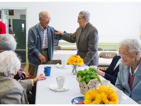 George Tsuchiya, 89 says good-bye to Bill Tanaka, 95, before leaving the Japanese Hall at 487 Alexander Street in Vancouver, BC, Oct. 15, 2018.