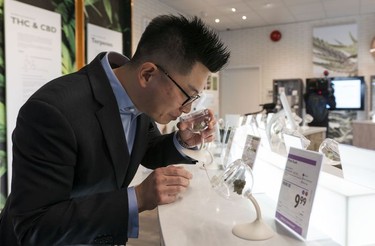 Michael Tan, Executive Director of Cannabis, demonstrates how a customer would use a sniffer at the BC Cannabis Store in Kamloops, Oct., 17, 2018.