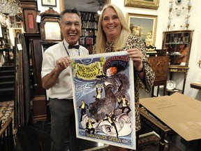 Thomas Przywara and Jeanette Langmann with a Vancouver Opera poster from the 1976 production of the Merry Widow.
