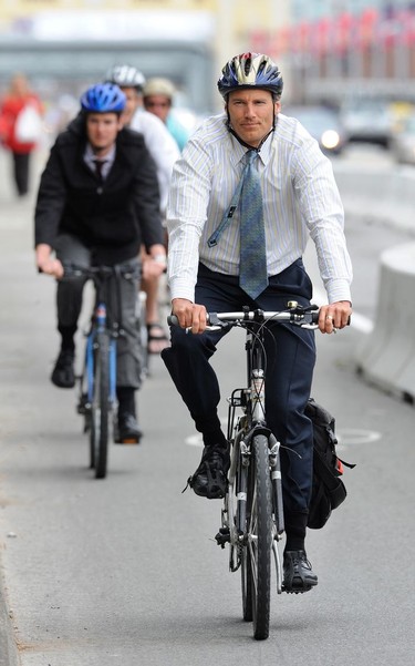 Mayor Gregor Robertson pedals southbound across the Burrard Street Bridge in Vancouver using the westernmost lane as vehicles are restricted to two lanes and pedestrians the use of the sidewalk July 13, 2009.