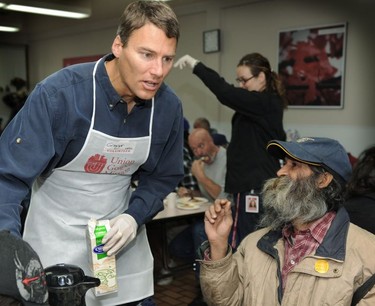 Mayor Gregor Robertson  helps serve a Thanksgiving meal at the Union Gospel Mission in Vancouver on Oct. 12, 2009.