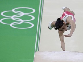 Uzbekistan's Oksana Chusovitina performs on the vault during the artistic gymnastics women's apparatus final at the 2016 Summer Olympics in Rio de Janeiro, Brazil, Sunday, Aug. 14, 2016.