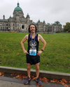 Ben Hanke of the Fraser Street Run Club in Vancouver proudly shows off his medal in Victoria after recording a surprising BQ 2:56:54.