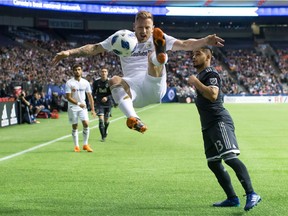 Former Whitecaps' defender, Jordan Harvey, now with Los Angeles F.C., will face Vancouver on Sunday in California. When Harvey visited Vancouver in April he impressed Cristian Techera, right, with his bicycle kick at B.C. Place Stadium.