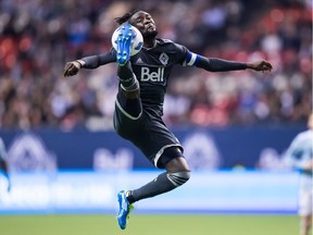 Vancouver Whitecaps' Kei Kamara jumps and receives a pass with his foot during the second half of an MLS soccer game against Sporting Kansas City in Vancouver, on Wednesday October 17, 2018.