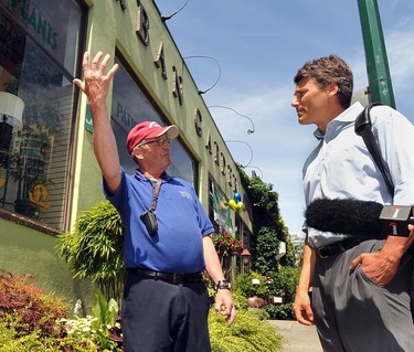 Mayor Gregor Robertson gets an earful from an irate local outside Art Knapp garden store at 1401 Hornby in Vancouver  B.C., on July 15, 2009.