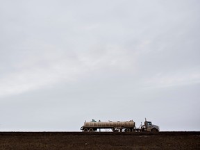 Canada's pipeline bottlenecks are pushing Canadian crude prices to the lowest in at least a decade, which has made shipping oil by truck more cost effective.